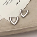 Minimalist silver triangle hoop earrings with a polished metallic finish in a chic style - Silver Heart Large
