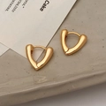 Minimalist V-shaped golden hoop earrings with high-polish finish on ceramic tray - Gold Heart Large
