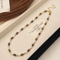 Detail of beaded necklace with natural shell and tiger eye beads in a velvet jewelry box - Natural Tiger Eye Shell Style (B-449)