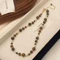 Macro detail of tiger eye stone necklace with pearls in a jewelry display box - Natural Tiger Eye Shell Style (B-450)