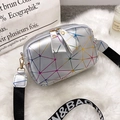 Silver laser geometric crossbody bag with printed wide strap on white faux fur background - Silver