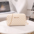 White leather crossbody bag with yellow floral pattern and golden chain strap - White