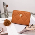 Brown quilted leather short wallet for women featuring gold flower hardware and pompom charm - Brown