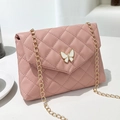 Pink quilted crossbody bag with butterfly clasp and gold chain shoulder strap - Pink