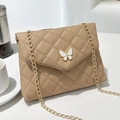 Elegant khaki quilted leather shoulder bag with a gold chain and white butterfly clasp - Apricot