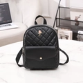 Black quilted mini backpack with a decorative pink rose and a gold buckle accent - Black