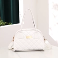 White quilted crossbody handbag with gold hardware and removable fabric shoulder strap - White