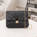 Elegant black quilted crossbody bag with gold chain strap and metal lock closure - Black