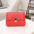 Elegant red quilted crossbody bag with gold chain strap and metallic twist-lock - Red