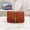 Brown quilted crossbody bag with golden chain strap and stylish tassel detail - Tan