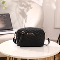 Black chevron quilted camera bag with gold logo and adjustable shoulder strap - Black