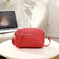 Red quilted chevron camera bag with golden logo and adjustable shoulder strap - Red