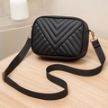 Elegant black chevron quilted crossbody bag with adjustable strap and gold hardware - Black