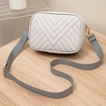 Chic beige quilted square shoulder bag with a wide grey fabric strap and gold hardware - Gray