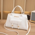 Elegant white crossbody square bag with gold logo and dual-handle design in vegan leather - White