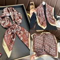 Macro detail of silk-like paisley square scarf in brown and gold with paisley pattern - 70x70cm / Brown Paisley
