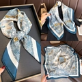 Close-up of paisley pattern silk scarf with blue, white, and orange color blocking - 70x70cm / Paisley Blue