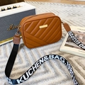 Brown quilted camera bag with stylish wide letter strap and golden metal hardware - Brown