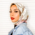 Satin silk scarf with golden chain print and ivory background worn as a chic headscarf - Pink Chain