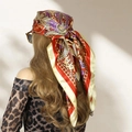 Large satin scarf with red and purple paisley print worn as a chic headscarf - Beige Orange