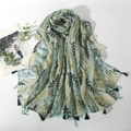 Linen feel printed scarf with leaf patterns and tassels in light green and yellow - Green
