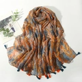 Bohemian printed scarf with abstract leaves and orange blue tassels on white background - Colorful