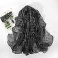 Detail of gray and black paisley pattern scarf featuring lightweight translucent fabric - Black