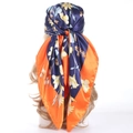 Blue and orange floral satin silk headscarf tied on a model in a stylish back view - 90*90cm / Orange Floral