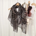 Leopard print leopard scarf in lightweight bali yarn draped on a wooden hanger with bag - Spliced Leopard-Gray