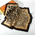 Detailed view of leopard print silk square scarf with elegant satin luster and black border - Leopard Style 15