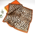 Close-up of leopard print silk scarf with brown edges and elegant satin finish texture - Leopard Style 12