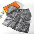 Detail shot of leopard print silk scarf in black and white with premium gift box - Leopard Style 9