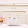 Elegant cream quilted shoulder bag with gold chain strap and V-pattern stitching - White
