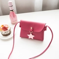 Chic magenta mini crossbody bag with star pendant and sleek gold snap button closure - Red