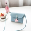 Light blue faux leather crossbody bag with lychee texture and pink star charm - Blue