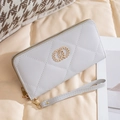 Light grey quilted long wallet with golden double ring buckle and wristlet strap - Gray