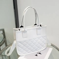 White quilted tote bag with adjustable shoulder strap and modern faux leather finish - White