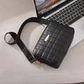 Black quilted crossbody camera bag with gold hardware and wide nylon shoulder strap - Black