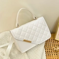White quilted crossbody bag with gold hardware and a woven strap for a stylish commuter look - White