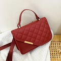 Deep red quilted crossbody bag with golden hardware and adjustable fabric strap - Red