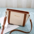 Detail of crocodile texture cream shoulder bag with golden Sunnycity logo and brown straps - Brown & Cream