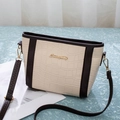 Detailed macro view of cream crocodile pattern leather with gold Summipitry logo - Coffee & Rice White
