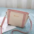 Close-up of pink and cream faux crocodile texture with gold Sunnycity metal logo - Pink & Rice White