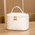Elegant white quilted makeup bag with gold hardware and top handle for travel storage - Large / White