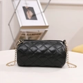 Black quilted cylinder crossbody bag with golden chain strap and zip closure - Black