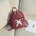 Mini burgundy faux leather backpack with large white bow and golden leaf zipper - Red