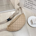 Beige quilted waist bag with V-shaped stitching and adjustable strap on a minimalist background - Apricot