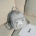 Light gray mini backpack for women featuring white bow detail and golden leaf zipper - Light Gray