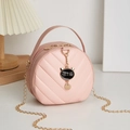 Pink round crossbody bag with V-quilted faux leather, gold chain, and cute cat pendant - Pink