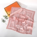 Pink silk square scarf with white paisley pattern displayed on a decorative orange gift box - 70*70cm / Pink White Floral Paisley
